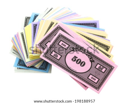 SWINDON, UK - JUNE 12, 2014: Pile Of Monopoly Money on a White Background,  The classic trading game from Parker Brothers was first introduced to America in 1935.