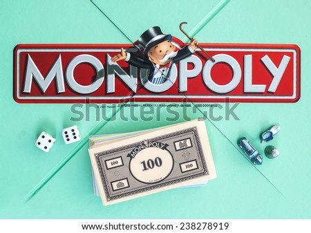 SWINDON, UK - JUNE 11, 2014: English Edition of Monopoly showing The Logo,  The classic trading game from Hasbro was first introduced to America in 1935.