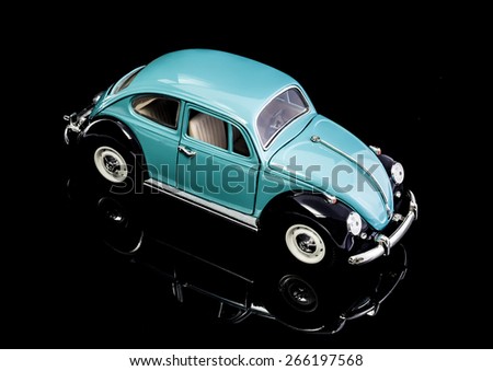SWINDON, UK - APRIL 3, 2014:  VW Beetle in Blue Die cast model on a white background.