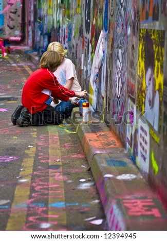 Graffiti Kids -Two boy spray Graffiti at CANS in London