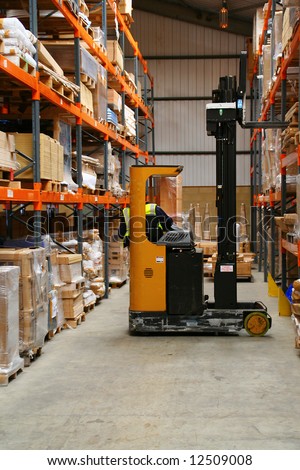 Fork Lift Truck in Warehouse with forklift driver