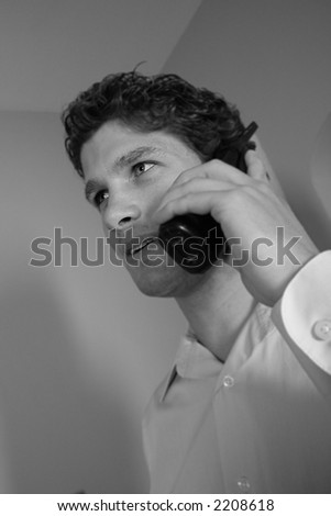 Black and white of man on the phone.  More with this model.