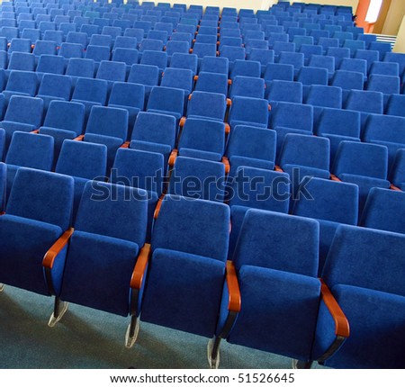 Empty chairs at cinema or theater. Blue Tone