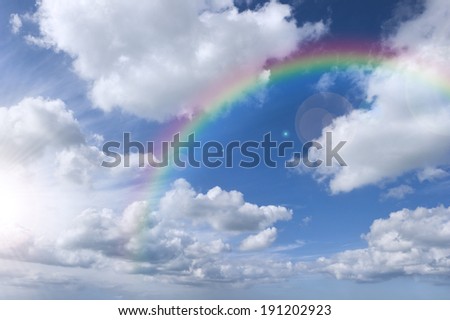 Cloudy sky with rainbow and bright sky