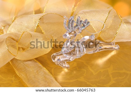 Christmas deer on a gold gift box