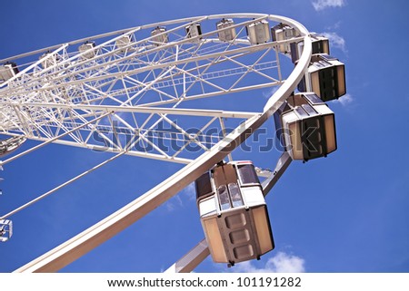 Ferris wheel against a blue sky