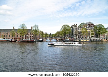 Cruising on the river Amstel in Amsterdam the Netherlands