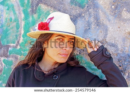 Beautiful woman against a graffiti background