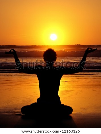 Meditation, Love and contemplation, yoga at sunset on the beach