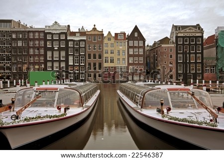 Amsterdam houses and cruise boats in the Netherlands