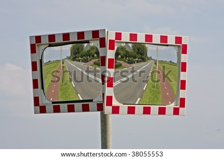 Two mirrors mirroring the road in the countryside
