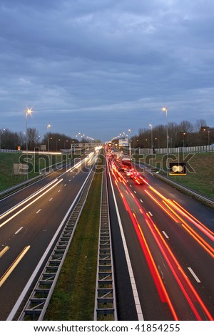 Traffic jam on the famous highway A9 near Amsterdam in the Netherlands at twilight