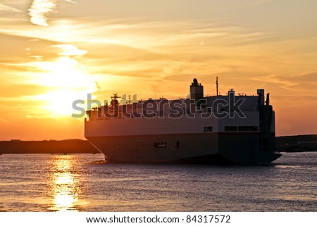 Cargo ship cruising at sunset in the Netherlands