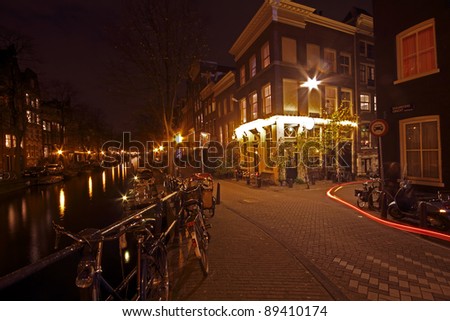 Romantic street view in Amsterdam city at night in the Netherlands