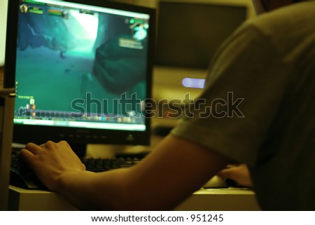 young guy playing computer game