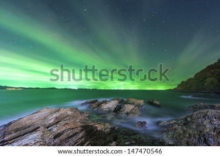 Night sea on green sky background