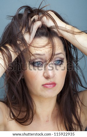 an image of upset  woman sad looking down