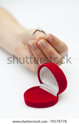 engagement ring on hand. stock photo : an image of engagement ring held in hand