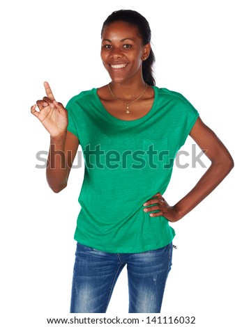 Beautiful black african young adult woman casually dressed in an emerald green t-shirt and Blue jeans and with her hair slicked back into a ponytail and isolated on a white background