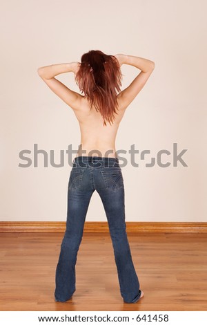 Backside of a girl, hand in her hair - no shirt on
