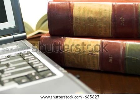 Laptop and Legal books on table - South African Law Reports - Shallow DOF