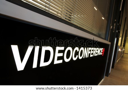 A notice against a wall of an office that reads:  Video Conference.
