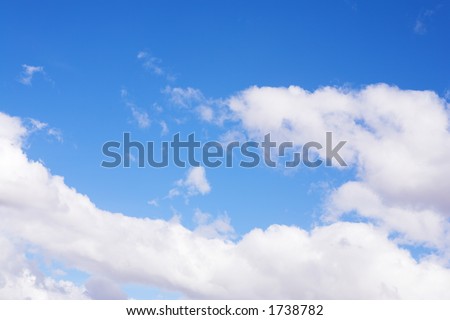Blue sky and white puffy clouds - For use as fill in backgrounds in designs and photo retouching
