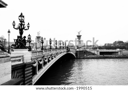 Pont Alexandre III - Bridge in Paris, France.  Movement on cars driving â€“ Gloomy winters day. Black and White