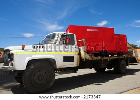 Flatbed Diesel Truck delivering explosives containers