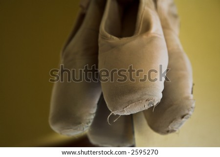 Pair of Ballet shoes hanging on the wall against a mirror – Shallow Depth of Field