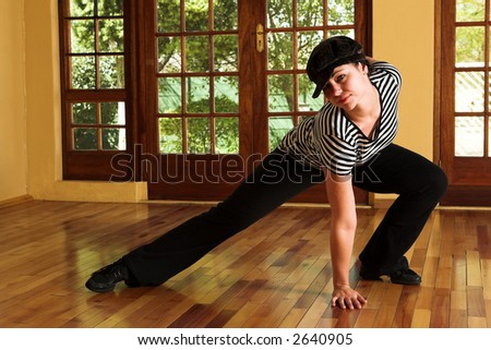 Modern Dancer in black Hat and striped top - Practicing in Studio