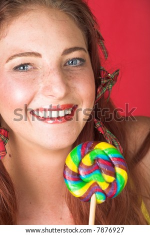  Young female adult fashion model with natural red hair and freckles in a