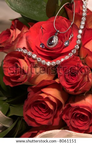 Expensive Jewelry in red rose wedding bouquet