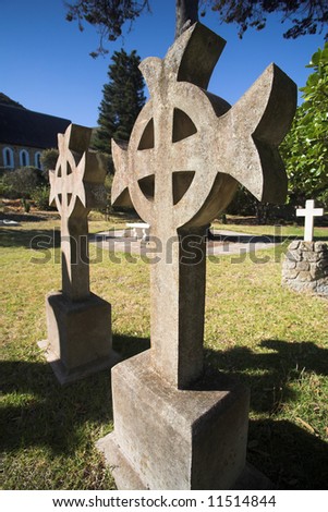 Irish Cross shaped old headstone of a grave made from granite