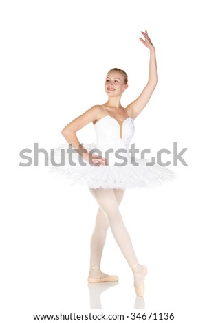 Young caucasian ballerina girl wearing a tutu on white background and reflective white floor showing various ballet steps and positions. Not Isolated