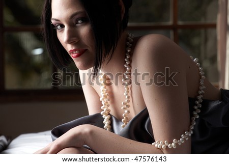  Adult Woman With Red Lips, Short Black Hair And A Pierced Eyebrow, 