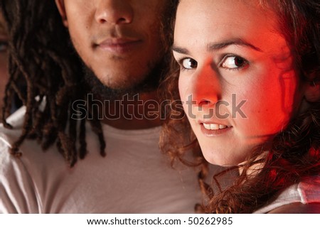 Portrait of male and female freestyle hip-hop dancers. Lit with spotlights