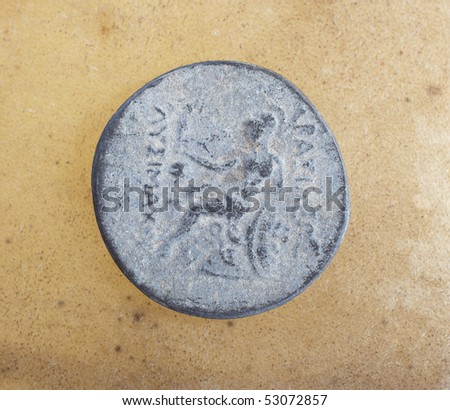 Antique ancient Greco-Roman coins from Turkey, on a smooth leather sheet.