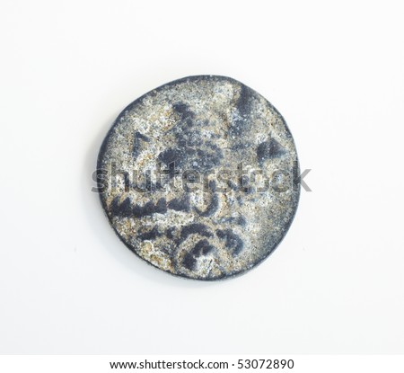 Antique ancient Greco-Roman coins from Turkey, on a smooth white examination table. Not Isolated