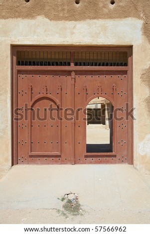 Main doorway of the rebuilt historic Fort Zubarah (Al Zubara) in North East of the deserts of Qatar on the edge of the Persian gulf on a sunny summer day