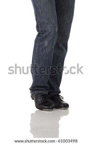 Single male tap dancer wearing jeans showing various steps in studio with white background and reflective floor. Not isolated