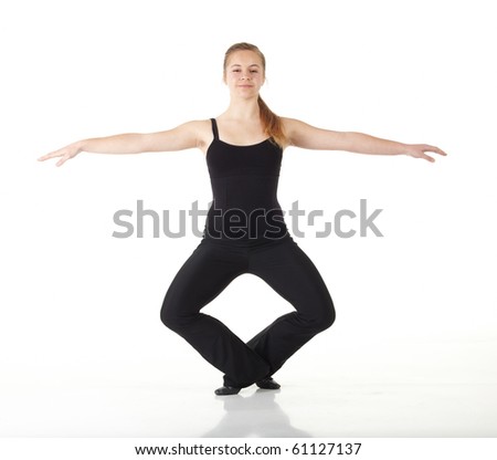 Young caucasian Modern Jazz dancer in a black top and black pants on a white background displaying various positions. NOT ISOLATED