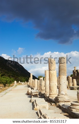 Pillars and collumns next to the main road in the old ruins of the city of Ephesus in modern day Turkey