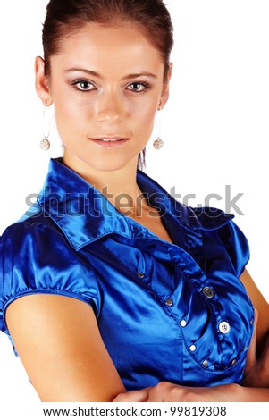 Young adult caucasian businesswoman with dark brunette hair and blue eyes wearing a fancy blue shirt with flawless skin and natural makeup on a white background.