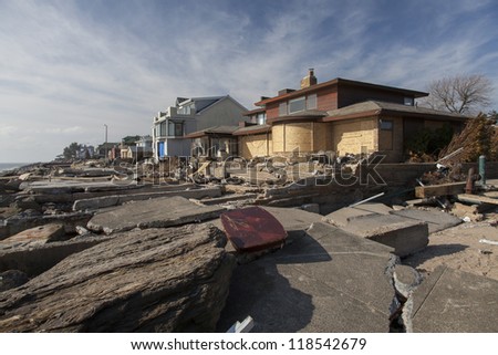 NEW YORK - NOVEMBER 12:Pile of garbage, debris near flooded and damaged house after Hurricane Sandy  on Manhattan Beach on November 12, 2012, Brooklyn, NY