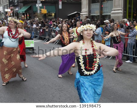 NEW YORK, NY - MAY 18: Members of Dances of Polynesia group dances on Broadway during 7th Dance Parade of New York on May 18, 2013 in New York City.