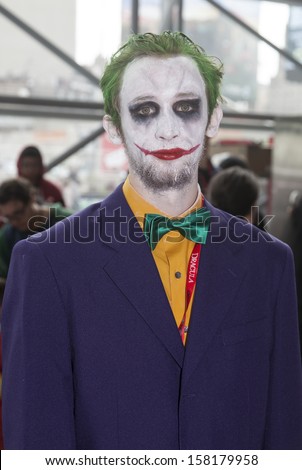 NEW YORK - October 13: Comic Con attendee poses in the costume of Joker during Comic Con 2013 at The Jacob K. Javits Convention Center on October 13, 2013 in New York City.