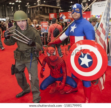 New York - October 13: Comic Con Attendees Posing In The Costume During Comic Con 2013 At The Jacob K. Javits Convention Center On October 13, 2013 In New York City.