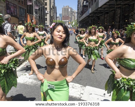 New York, NY, USA - May 17, 2014: Members of Tahitian Lei Pasifika Lotus Music & Dance march at The 8th Annual New York City Dance Parade and Festival