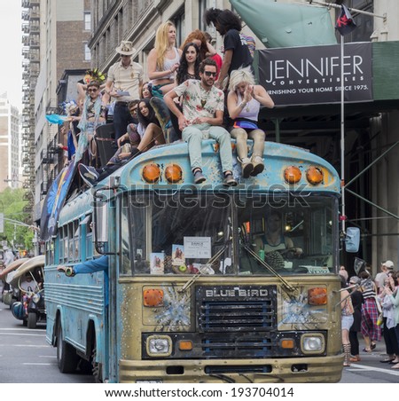 New York, NY, USA - May 17, 2014: Blue Bird bus with Blue  Byrds dance group drive at The 8th Annual New York City Dance Parade and Festival
